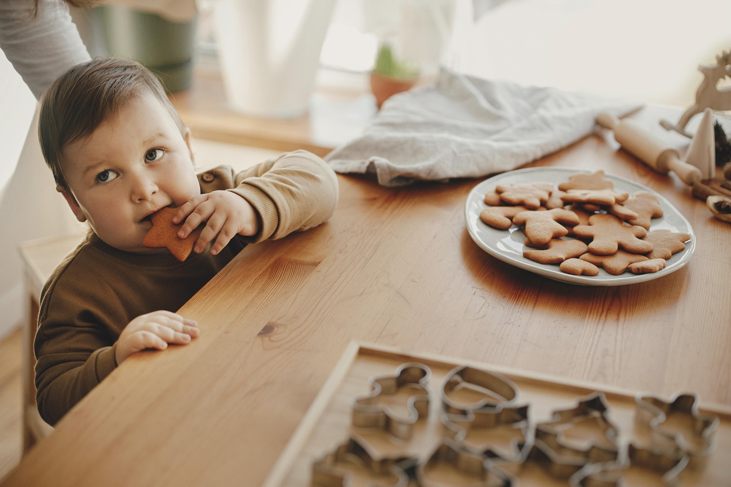 Cute Little Girl Eating Freshly Baked Gingerbread